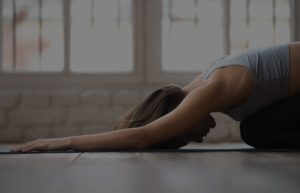 People doing yoga in a yoga studio